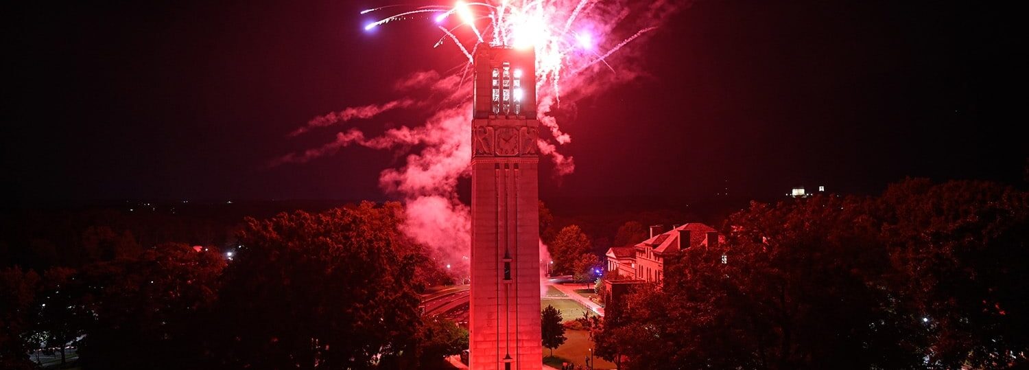 Red fireworks light up the sky above the Belltower as an explosive end to Packapalooza 2022.