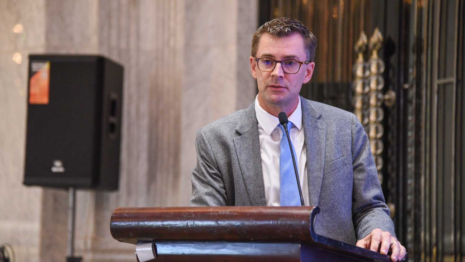 a man standing at a podium